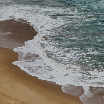 Beach with waves crashing onto the shore